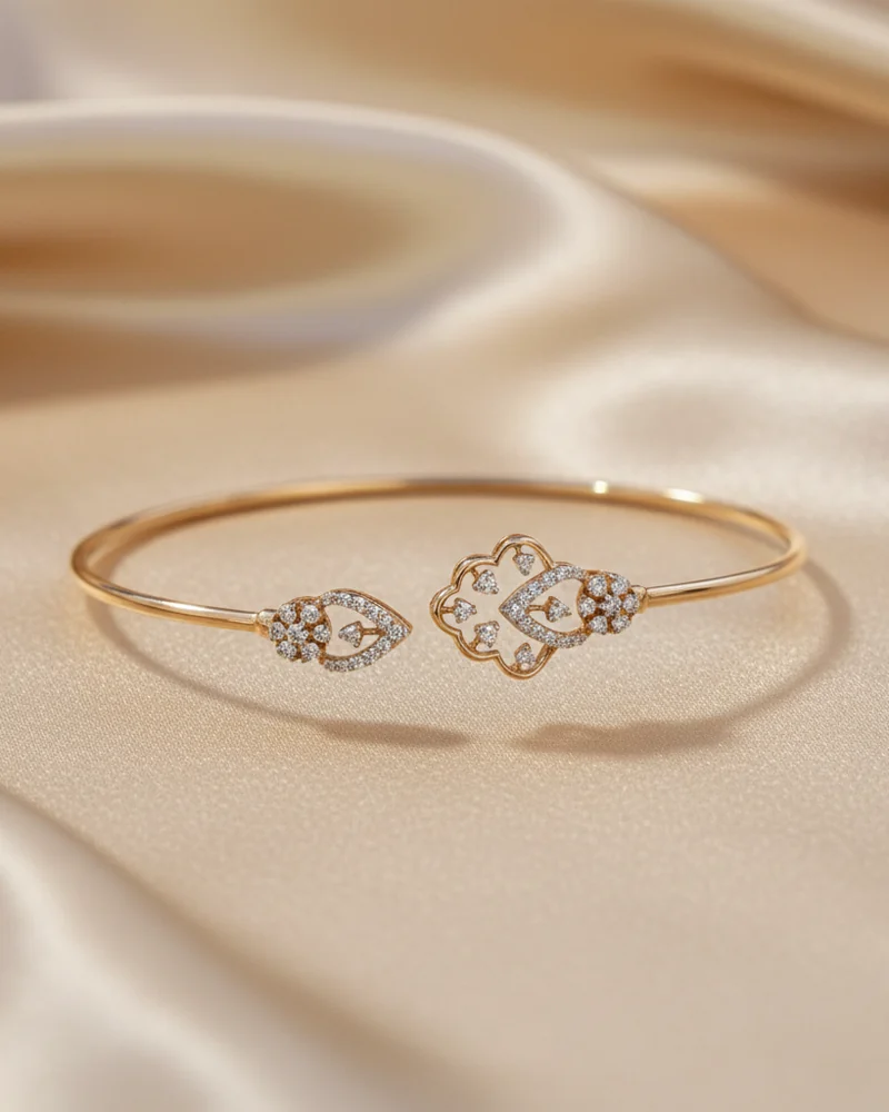 A fine gold bracelet with a diamond clover at the centre.