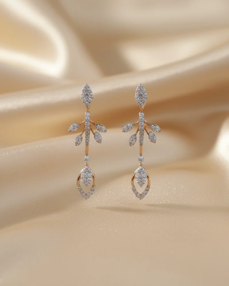 A pair of long earrings with marquise diamonds set in a fine line.