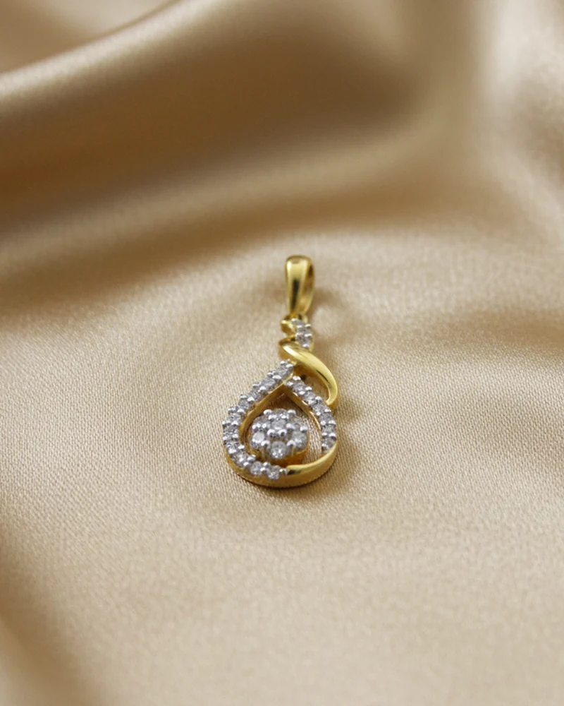 A gold crescent pendant holding a single round diamond.